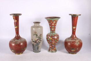 Pair of Oriental cloisonné enamel bottle vases, 31cm high, a red ground cloisonné baluster vase