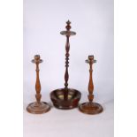 A pair of turned oak candlesticks, 33cm long and a 19th century mahogany stand, 53cm tall. (3) #313