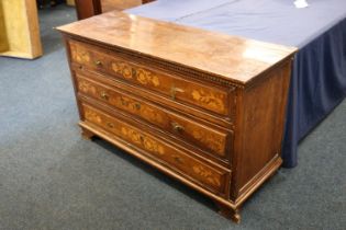 An 18th century Italian mahogany chest of drawers with three drawers and floral marquetry inlay,