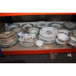 Shelf of china, plates, cups, serving dishes, etc.