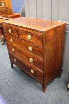 An 18th century Sheraton style flame mahogany and crossbanced chest of drawers with two short over