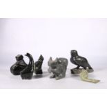 Six Canadian or Inuit soapstone carvings to include a reclining seal, a squirrel, a falcon, etc.  (