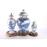 Three Chinese blue and white porcelain temple jars and covers, the largest 37cm high.  (3)  (a/