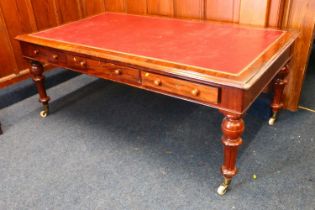 A Victorian flame mahogany library table or partners desk, the inset red leather skiver top with