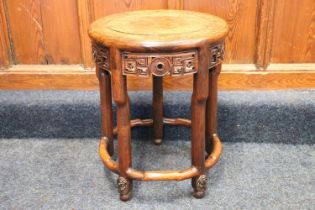 A Chinese hardwood circular occasional table or stool with pierced work frieze, 39cm diameter. #96