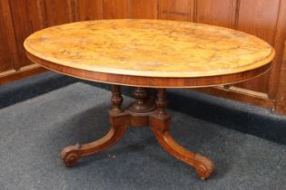 Victorian walnut marquetry tilt top loo table, the oval top raised on four column supports