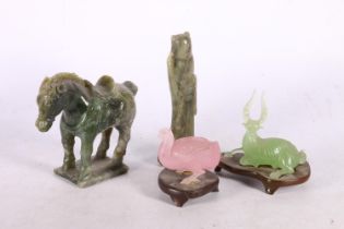 Peking glass pink goose, a Peking green glass deer, a green hardstone Tang style horse, and a jade