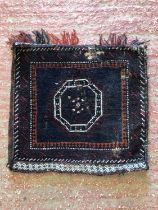 Hand woven bag face with areas of wear, along with another mat.