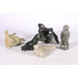 Five Canadian Innuit soapstone or serpentine carvings comprising a hunter with tent, a kneeling