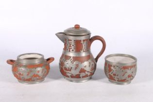 Chinese Ho'Chen pewter and terracotta three piece coffee set.  (3)