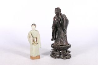 Oriental bronzed pewter or lead figure of a gentleman in robe, on wooden stand, 23cm high and a