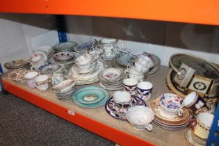 Shelf of assorted china to include tea cups, saucers, dishes, etc.