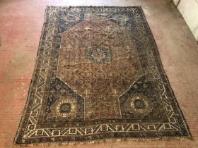 Caucasian rug with medallion on field with floral decoration and having joined spandrels, well