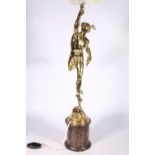 A table lamp with marble base surmounted by a brass figure of winged Mercury, 73cm tall. #470