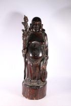 Carved wooden figure of a Chinese immortal Pu-tai, 57cm high.  #485