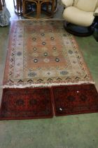 Multi border fringed rug and two prayer matts (3).