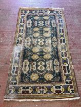 North west Persian rug with foliate design to green field, well worn, and another, larger 220 x