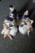 Pair of Royal Dux clown bookends, 22cm, and two boys carrying jugs.