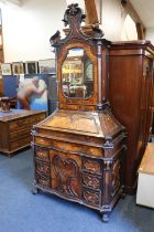 An 18th century Italian walnut bureau, with shaped lantern top, the fall-front fitted with