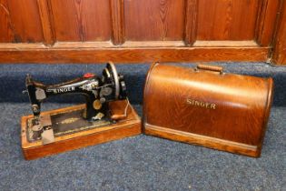 Oak cased Singer sewing machine.