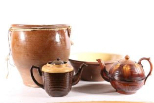 Glazed stoneware storage crock, 30cm high, two treacle glazed teapots, and a vintage mixing