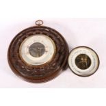 Brass-cased bulkhead barometer, 14cm, and another with carved mahogany mount.  (2)