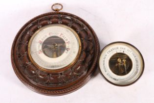 Brass-cased bulkhead barometer, 14cm, and another with carved mahogany mount.  (2)