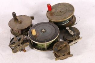 Five antique fishing reels to include Hogg, Anderson & Sons, Edinburgh, etc.