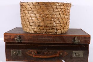 Vintage leather suitcase and a basket.