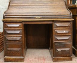 Cutler oak roll-top desk with tambour front and fitted interior, 125cm wide.