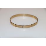 9ct gold bangle of plain form, 14.9g.