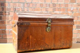 Dome-topped tin trunk.