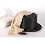 Gentleman's collapsible top hat, a christening gown, a child's shoe, a purse and a tapering length