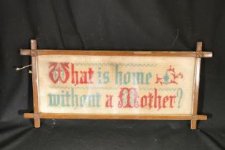 Early 20th century framed sampler,  'What is Home Without a Mother', 57cm wide.