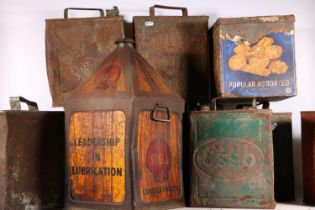 Nine vintage petroleum and oil cans to include Shell, Pratt and BP, etc.