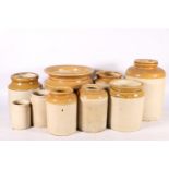 Ten stoneware storage jars of varying sizes, largest 26cm high.  (10)