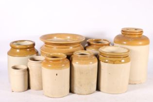 Ten stoneware storage jars of varying sizes, largest 26cm high.  (10)