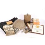 WWII helmet, a water canteen, and cap badges to include KOSB, along with WWI and WWII ephemera to
