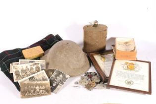 WWII helmet, a water canteen, and cap badges to include KOSB, along with WWI and WWII ephemera to