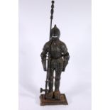 Cast iron companion stand in the form of a knight.