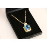 14ct gold pendant set with a vibrant blue rectangle cut stone, on 14ct gold chain 23cm, 11.4g.