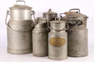 Six galvanized milk churns of varying sizes, largest 45cm high.