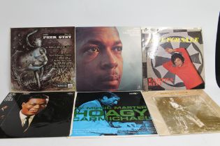 Collection of records to include Miles Davis Collectors Items, two other albums, Frank Sinatra His