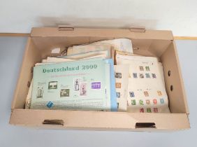 Box containing a large quantity of mixed world postage stamps and album sheets to include issues