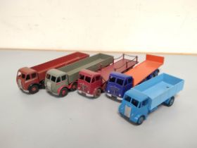Dinky Toys. Group of die-cast vehicles to include Guy 4-Ton Lorry no 511, Foden Flat Truck With