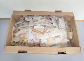 Box containing a large quantity of mixed world postage stamps.
