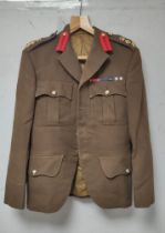 Post war British Army tunic of the Highland Light Infantry belonging to Maj G.B Campbell bearing