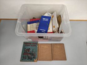 Box containing an assortment of world stamp albums and guides.
