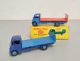 Dinky Toys. Boxed diecast Guy Flat Truck no 433 with light blue cab & orange bed. Also another loose