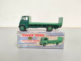 Dinky Toys. Boxed diecast Guy Flat Truck with Tailboard no 513 with dark green cab & light green